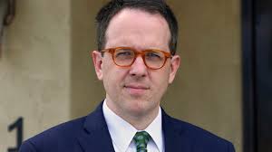 Drone video shows great white sharks just feet from California surfers