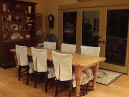 Dining chairs catch it all. 20 Interesting Dining Room Chair Cover Ideas Dining Room Chair Covers Dining Room Chair Slipcovers Rustic Dining Room Chairs