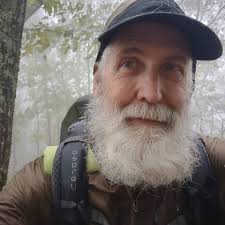 What are some strategies for foot care while hiking in rainy conditions?