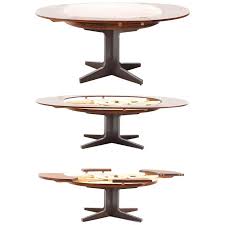 Great for expanding to accommodate a group, then returning it to its more compact size for regular use, a hidden leaf dining table can give you the luxury of a large table without the constant problem of it taking up too much space. Rare And Fantastic Dyrlund Smith Flip Flap Dining Table In Rosewood 1960s Room Of Art