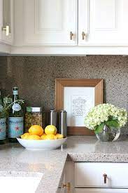 Here, kristen nix interiors punched up this honed quartz countertop in bright white with a bold, bronze star sculpture. Belle Maison Styling 101 The Kitchen Countertop Kitchen Countertops Kitchen Counter Decor Kitchen Staging