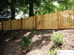 Traditional Picket Fence Design With A Twist We Love The Alternating Picket Height Fences Picket Fence Design Wood Picket Fence Picket Fence