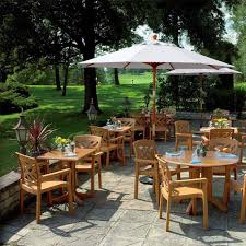 Outdoor furniture grills accessories our outdoor design specialists will help you find the perfect furniture for your outdoor vision. Grosfillex Ut380008 42 Round Atlanta Outdoor Table W Umbrella Hole Melamine Teakwood