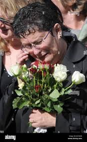 Former Mother-in-Law Jane Perrin reacts as the coffin of Acting Sergeant  Michael Lockett MC, 2nd Battalion The Mercian Regiment, is driven through  Wootton Bassett following his repatriation at RAF Lyneham, Wiltshire Stock