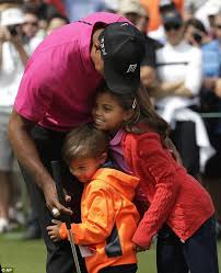 At Least He Has Three Fans Tiger Woods Enjoys Hugs On The Golf Course Tiger Woods Tiger Woods Children Children Hitting