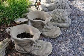 One of the coolest aspects of this project is the idea of filling the very bottom of the boots with concrete or gravel to weigh them down, especially. Antique Designed Whimsical Planter In The Design Of A Large Boot Just A Fun Piece For That Special Pl Cement Flower Pots Concrete Garden Diy Concrete Planters