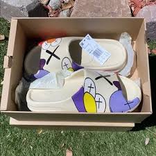 The adidas yeezy slide core is composed of a core eva foam throughout the design to provide lightweight comfort. Yeezy Shoes Kaws Yeezy Slides Poshmark