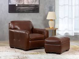 These brown colored ottomans are sure to add a rustic look to your living space and add a notable charm to it. Winslow 2 Piece Brown Leather Chair Ottoman Set Costco