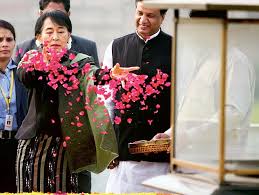 A young child can be seen clinging to his chest and wailing. India Should Help In Burma S Struggle Says Pro Democracy Icon Aung San Suu Kyi As She Makes Her First Trip To Delhi For 25 Years Daily Mail Online