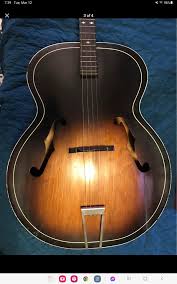 Rebuilding a Harmony H802 Tulip guitar