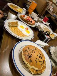 We did not find results for: Traditional American Breakfast At A Restaurant Chocolate Chips Pancakes Sausages Sunny Side Eggs Hashbrows And French Toast At A Restaurant Phone Picture Stock Photo Picture And Royalty Free Image Image 121788816