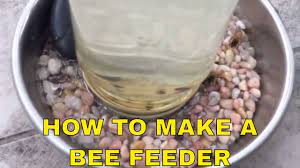 This is a super easy diy project and all you need is a plastic pail with a snap on lid and a drill. Diy How To Make A Bee Feeder Helping Honey Bees Youtube