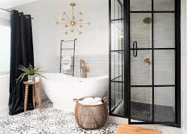 This white polished or high gloss finish tile will make a great impact in small areas like the bathroom, den, or other overlooked spaces. Black And White Mosaic Tiles With White Oval Bathtub Eclectic Bathroom