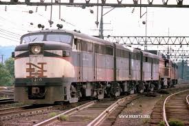 Fa 1 0410 Leads What Appears To Be A Hospital Train Dead Equipment Consisting Of What Looks Like A Burned Up Fb 1 And F Train Railroad Pictures Railroad Art