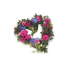 Purple iris and blue iris are often used as funeral flowers for soldiers as they convey respect, hope and faith. Mixed Flower Open Heart Funeral Wreath Irish Flowers Leixlip Florist