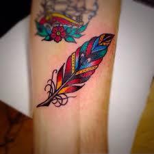 Colored peacock feather tattoos designs. 50 Feather Tattoo Ideas Best Designs Canadian Tattoos