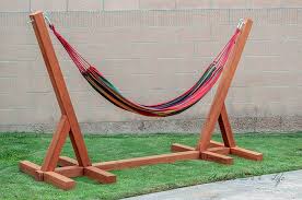 Just 2 wooden posts, few bags of concrete and some heavy duty hooks! Diy Hammock Stands That Would Look Perfect In Your Backyard