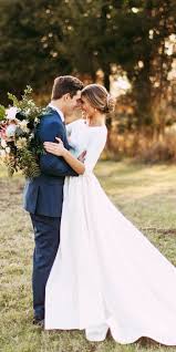 Plus size long sleeve wedding dress with low back. 27 Silk Wedding Dresses For Elegant And Refined Bride Wedding Dresses Guide Long Sleeve Wedding Dress Simple Modest Wedding Dresses Backless Wedding Dress