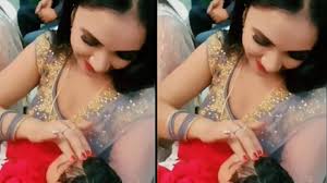 A year after the MMS controversy, Bhojpuri singer Trisha Kar Madhu's latest  video with a child goes VIRAL | Bhojpuri Movie News - Times of India