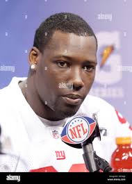 New York Giants' Jason Pierre-Paul, left, talks with defensive coordinator  Steve Spagnuolo during NFL football training camp in East Rutherford, N.J.,  Sunday, July 30, 2017. (AP Photo/Seth Wenig Stock Photo