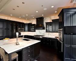 Refaced satin white shaker style kitchen cabinets enabled this homeowner's budget to afford this fresh, contemporary kitchen remodel features luna pearl granite countertops, stainless steel accents, and a grey marble backsplash. Black Cabinets W White Carrera Marble Countertops Black Kitchen Cabinets Kitchen Style Dark Kitchen Cabinets