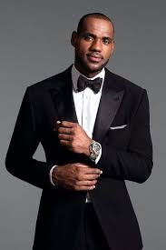 Black And White Suit With Bow Tie Lebron James Wearing Black Suit White Dress Shirt Black Bow Tie White And Black Vertical Striped Pocket Square Wedding Suits Men Best Wedding Suits Nba Fashion