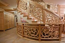 Dark wood paneling makes up the steps, risers and platforms with black rails and glass. Unique Carved Wood Staircase Ideas An Exclusive Feature Of Interior Design