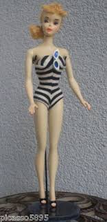 Black And White Bathing Suit Barbie Toymaster Love The First Barbie The First Barbie Was Made In 1959 She Wore A Black And White Striped One Piece Bathing Barbie Dolls Barbie Vintage Barbie