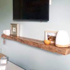 It's also a stylish solution that. Timber Floating Shelf Under Tv In Natural Live Edge Marri Floating Shelves Living Room Floating Shelves Bedroom Timber Floating Shelves