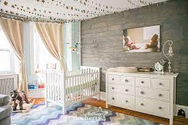 Whimsical Gender Neutral Nursery With Grey Plank Wood Wall Gender Neutral Nursery Nursery Neutral Unisex Nursery Decor