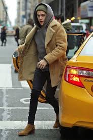Harry styles seems to have a thing for saint laurent boots as they make up a significant percentage of his collection. Harry Styles Wearing Tan Shearling Coat Grey Hoodie Black Skinny Jeans Tan Suede Chelsea Boots Lookastic