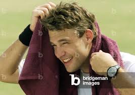 Image of DANIEL VETTORI OF NEW ZEALAND COVERS HIS FACE DURING PRACTICE