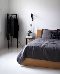 Clean Headboard Small Simple Nightstand Cord Light Exposed Clothes Rack No Rug Mens Bedroom Mens Bedroom Decor Home Decor Bedroom