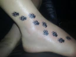 Paw prints usually are smaller, placing your tattoo on your neck, behind your ear, on your arms and even on a finger is a great idea to show off this minimalist yet captivating design. Dog Paw With Name Tattoo Novocom Top