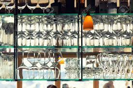 This beautiful wall art is printed using the highest quality fade resistant ink on canvas. Wall Of Many Empty Transparent Wine Glasses On Glass Shelf At Stock Photo Picture And Royalty Free Image Image 139251104