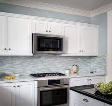 So even though farmhouse kitchens tend to pair well with stone backsplashes, you can still choose to use a white subway tile to contrast your wood cabinets, stone floors and butcher block countertops. Kitchen Inspiration Oceanside Glass Tile