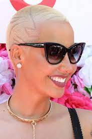The signature blonde short haircut has made her an extremely recognizable female in the entertainment field. Amber Rose S Hairstyles Hair Colors Steal Her Style