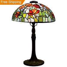 It has golden both a curved pole and a round base. Tulip Stained Glass Lamp Shades For Table Lamps Small Tiffany Table Lamps Buy Small Tiffany Table Lamps Stained Glass Dining Room Light Stained Glass Table Lamps For Sale Product On Alibaba Com