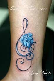 Watercolor tattoo music notes tattoo. 35 Awesome Music Tattoos For Creative Juice