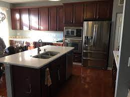What this means is, the grain in the wood absorbs different amount of stain color at different rates and depths. Should I Paint My Cherry Cabinets D Franco Painting Wallpaper