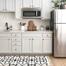 Boho cotton area rug runner indoor throw rug carpetif you're looking to bring an exotic and elegant feel. See Four Stylish Takes On The New Black And White Kilim Rug From Nate Berkus S Spring White Kitchen Rugs Gray And White Kitchen Kitchen Cabinets Grey And White
