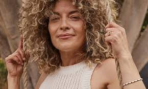 Jodie Comer models a prosthetic baby bump and reveals she was 'terrified'  at the thought of working with 15 babies for her latest film The End We  Start From