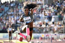 Colombia's flag bearer caterine ibarguen jumps for a photo during the opening ceremony of the tokyo 2020 olympic games, at the olympic stadium, in tokyo, on july 23, 2021. Por Siete Centimetros Caterine Ibarguen Gano Segunda Valida Del Salto Triple En La Liga De Diamante Entornointeligente