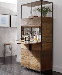 Organize the home bar with a bar cabinet for spirits, wine and drinkware. These Home Cocktail Bar Ideas Are Perfect For The Party Season