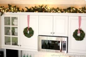 Intertwine them with string lights to create soft accent lighting. Kitchen Christmas By A Thoughtful Place Christmas Kitchen Decor Christmas Kitchen Fun Christmas Decorations