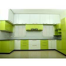 Kitchen features a plank ceiling over sage green cabinets with brass pulls, sage green wooden kitchen hood over white marble slab backsplash, polished nickel swing arm pot filler, kitchen island with white marble waterfall, brown oak and orange leather woven counter stools, illuminated by black and white cage drum lanterns. Green White Modular Pvc Kitchen Cabinet Rs 1100 Square Feet Kitchen Com Id 20559055673