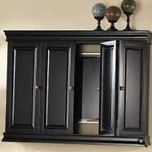 Hidden flat screen tv cabinet. Love This Idea To Hide A Big Flat Screen Tv Because It Should Never Be The Focal Point Of The Room Tv Wall Cabinets Living Room Tv Wall Wall Mounted Tv