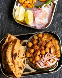 Hello Friyay Ringing In The Weekend With Our Favourite Chana Masala And Paranthas What S For Dinner At Your Table To Indian Food Recipes Chana Masala Food