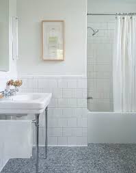 If you already have hardwood in your however, the best kind of tile for bathroom floors is the one that fits with your home's aesthetic. White And Gray Bathroom Features Off White Paint On Upper Walls And White Square Porcelain Tiles On White Tile Bathroom Walls Bathroom Wall Tile Tile Bathroom
