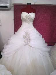 Way Too Much Bling Going On Here But The Idea Of The Ruffles At The Top And A Flow To The Botto Ruffle Wedding Dress Ball Gowns Wedding Crystal Wedding Dresses